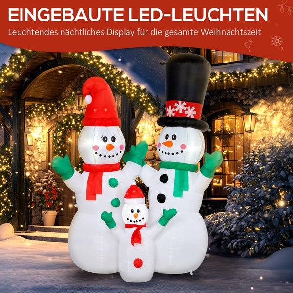 Drei aufblasbare Schneemänner mit integrierten LED-Leuchten als weihnachtliche Außendekoration vor einem beleuchteten Haus bei Nacht.