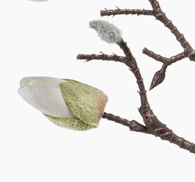 Künstlicher Magnolienzweig mit weiß-grüner Knospe aus Textil und Kunststoff.