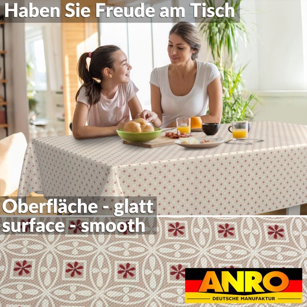 Abwaschbare Tischdecke mit geometrischem Blumenmuster auf einem Esstisch in einem hellen Raum mit Mutter und Kind. ANRO Logo.