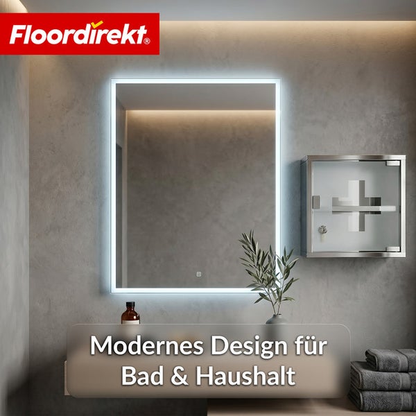 Beleuchteter LED-Badezimmerspiegel in einem modernen Badezimmer mit Medizinschrank, Pflanze und Handtüchern. Floordirekt Logo.
