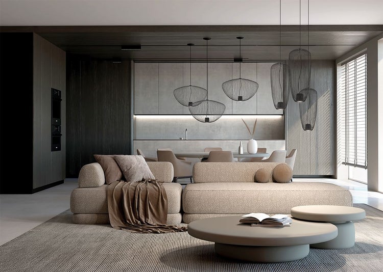 Modernes Wohnzimmer mit offener Küche, hellem Sofa, runden Couchtischen und dekorativen schwarzen Pendelleuchten aus Drahtgeflecht.