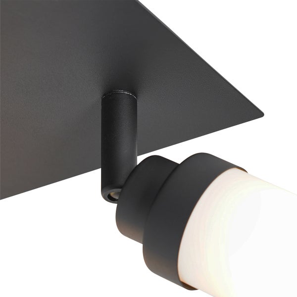 Nahaufnahme einer schwarzen Deckenleuchte mit zylinderförmigem Lampenschirm