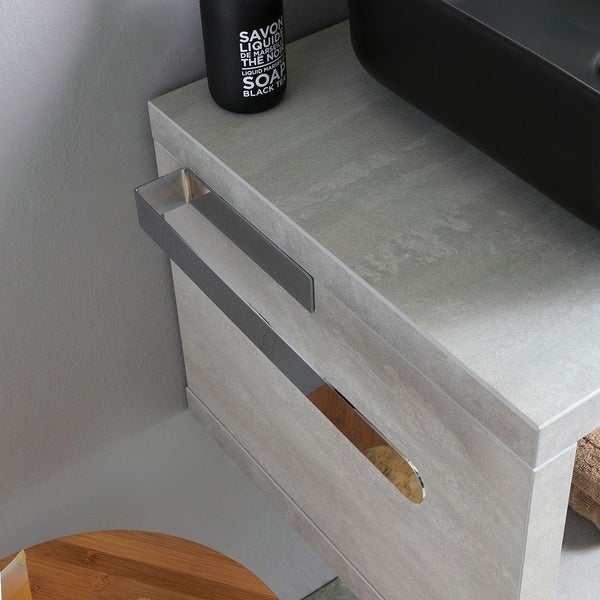 Detailansicht eines Waschtischunterschranks mit Schublade und schwarzem Aufsatzwaschbecken.