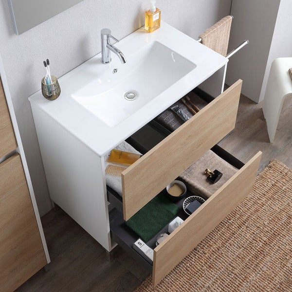 Moderner Badezimmer-Waschtisch mit Keramikbecken, verchromter Armatur und zwei offenen Schubladen in Eichenholzoptik.