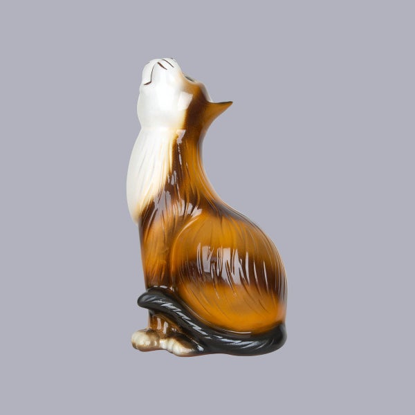 Deko-Figur Katze aus Glas, sitzend und nach oben schauend.