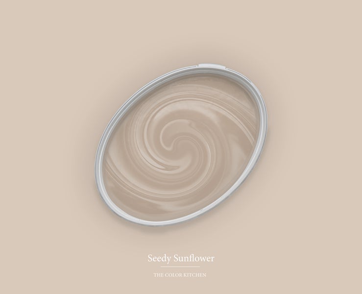 Beige Wandfarbe Seedy Sunflower von The Color Kitchen in einem ovalen Behälter mit Wirbelmuster in der Draufsicht.