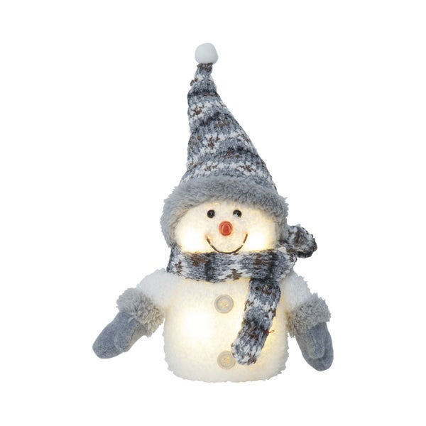 Dekorativer Schneemann mit Mütze und Schal für die Weihnachtszeit
