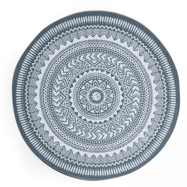 Runder In- und Outdoor-Teppich mit geometrischem Mandala-Muster.