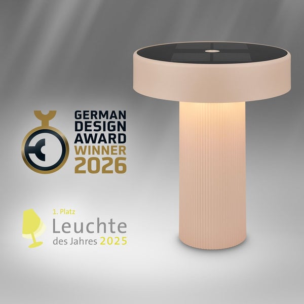 Solarleuchte mit geriffeltem Sockel, rundem Design und Solarpanel, German Design Award Winner 2026 und erster Platz Leuchte des Jahres 2025.