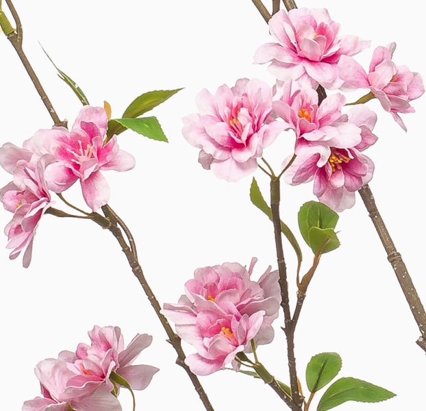 Künstlicher Kirschblütenzweig mit rosa Blüten und grünen Blättern.