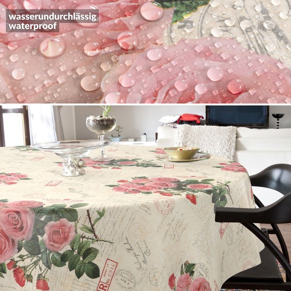 Wasserundurchlässige runde Tischdecke mit Rosen-Muster im Vintage-Stil und Schriftzügen, Nahaufnahme von Wassertropfen auf dem Stoff.