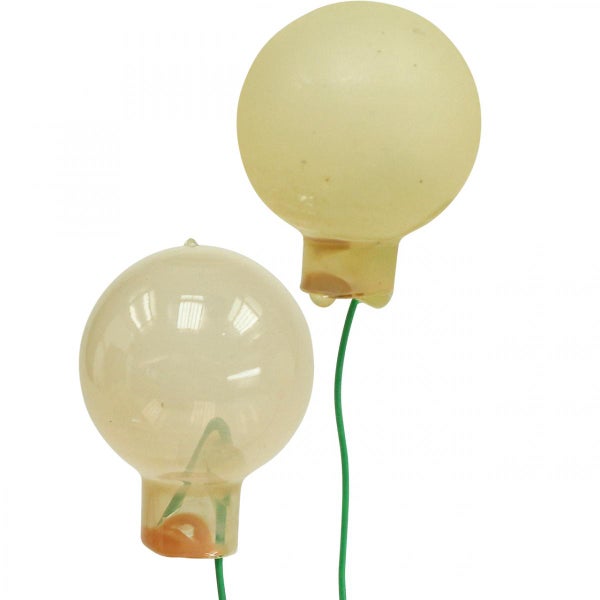 Zwei runde Leuchtmittel mit grünen Zuleitungen