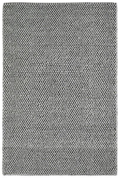 Grauer Teppich mit strukturierter Kugeloptik aus Filz oder Wolle.