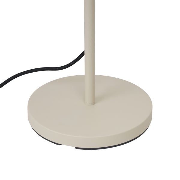 Runder Lampenfuß in Beige mit schwarzem Anschlusskabel.