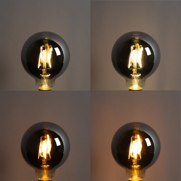 LED-Globe-Leuchtmittel mit Filament und Rauchglas, dargestellt in vier verschiedenen Helligkeitsstufen.