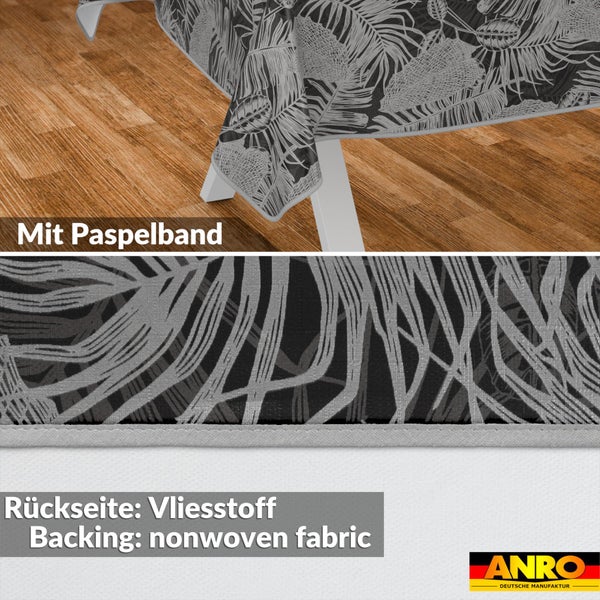 Wachstuch-Tischdecke mit Blattmuster, Paspelband am Saum und Rückseite aus Vliesstoff. ANRO Logo.