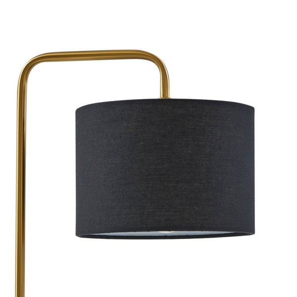Detailansicht einer Leuchte mit schwarzem Textilschirm und goldfarbenem Metallgestell.