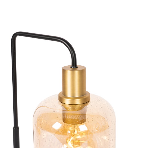 Nahaufnahme einer Tischleuchte mit einem Lampenschirm aus Glas und einem Leuchtmittel