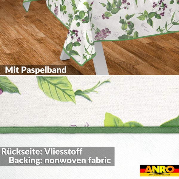 Tischdecke mit Blumenmuster, Paspelband und Vliesstoff-Rückseite. ANRO Logo.