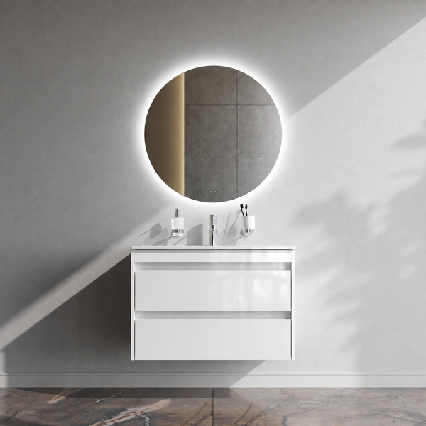 Moderner Waschplatz mit hängendem Unterschrank, rundem LED Spiegel und Waschbecken in einem minimalistisch gestalteten Badezimmer.