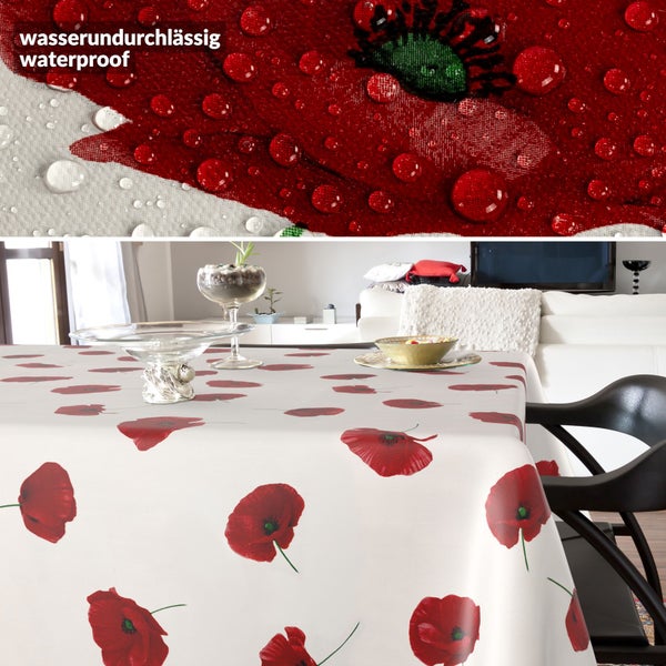 Wasserundurchlässige Tischdecke mit Mohnblumen-Muster auf einem Tisch, Detailansicht zeigt Wassertropfen auf dem Stoff.