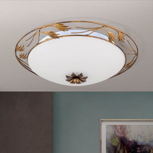 Runde Deckenleuchte mit ornamentalem Rahmen in Blattoptik und einem Diffusor aus Glas für eine gleichmäßige Lichtverteilung