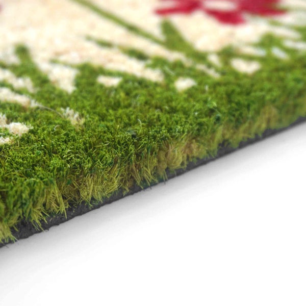 Detailansicht einer Fußmatte mit floralem Muster.