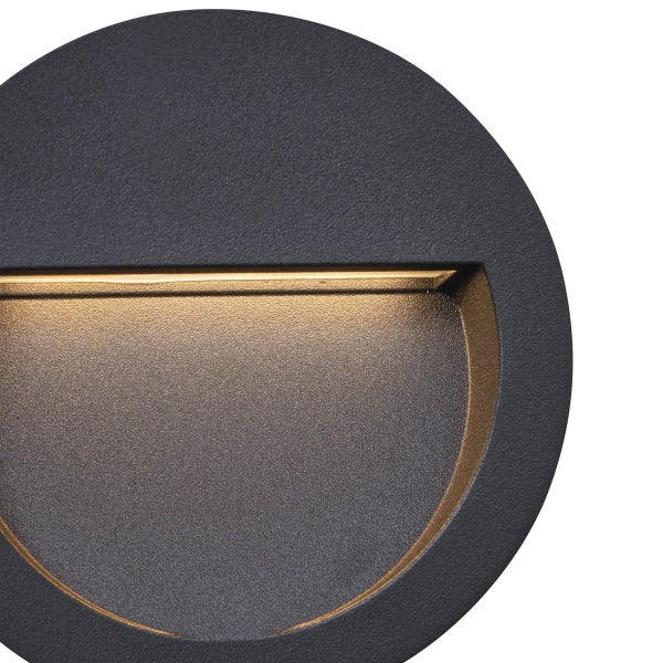 Rundes LED-Außenwandlicht aus anthrazitfarbenem Metall mit indirektem Lichtaustritt nach unten.