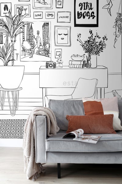 Dekoratives Wohnzimmer mit gemusterten Tapeten, Sofa, Kissen und Decke.