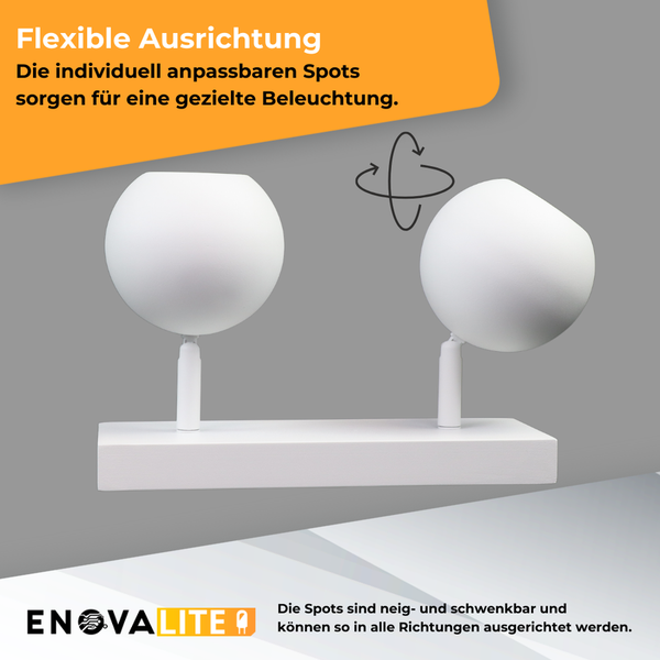 Zwei weiße, verstellbare Spots auf einer Halterung für flexible Beleuchtung.