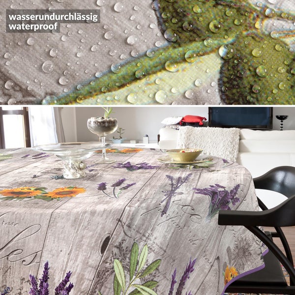 Runde Tischdecke in Holzoptik mit Lavendel- und Sonnenblumenmotiven. Detailaufnahme der wasserabweisenden Materialoberfläche.