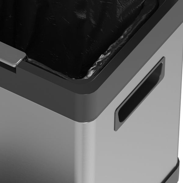 Nahaufnahme eines Mülleimers aus Edelstahl mit integriertem Griff und schwarzem Müllbeutel.