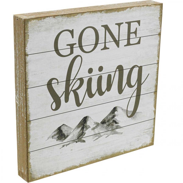 Dekoratives Schild mit der Aufschrift 'Gone Skiing' und Bergmotiv