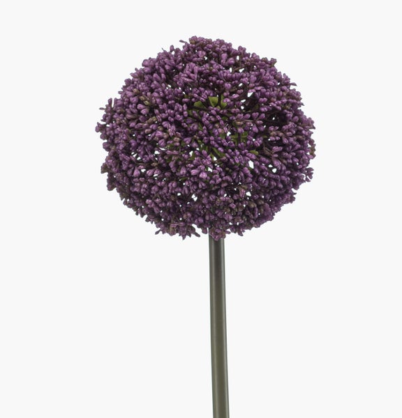 Künstliche Blume mit rosafarbenen Blütenblättern und grünem Stängel.
