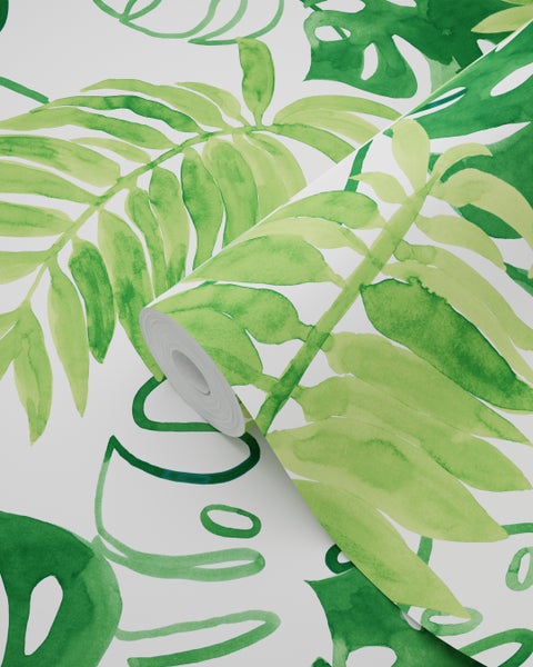 Eine Rolle Tapete mit einem grünen Blättermuster.