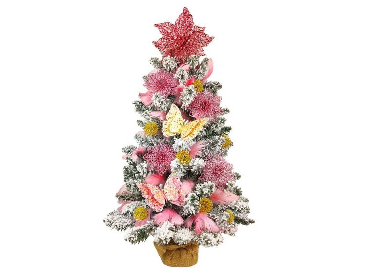 Künstlicher Weihnachtsbaum mit künstlichem Schnee, dekoriert mit Blumen, Schmetterlingen und Kugeln in einem Jutesack.