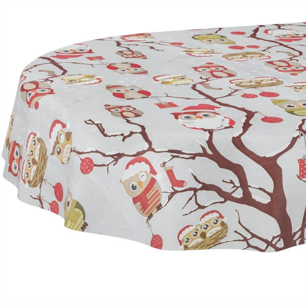 Runde Tischdecke mit winterlichem Eulen-Motiv, Zweigen und Weihnachtsschmuck.