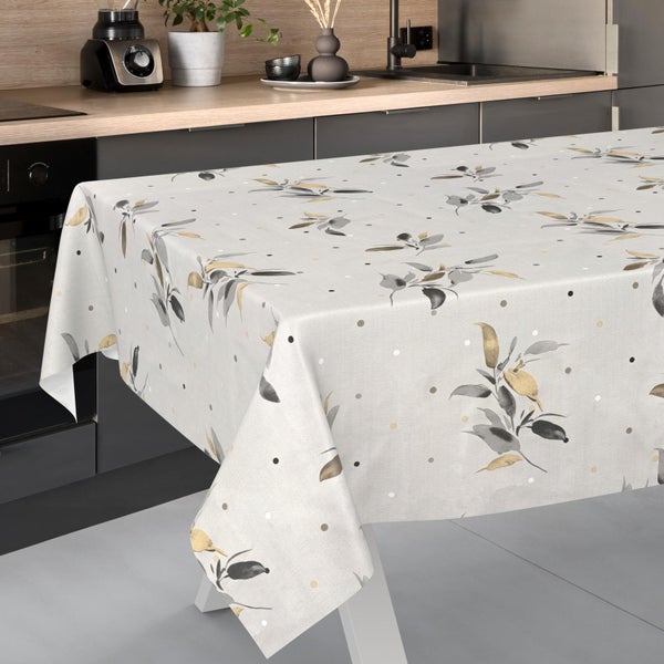 Rechteckige Tischdecke mit Blattmuster und Punkten auf einem Tisch in einer modernen Küche.