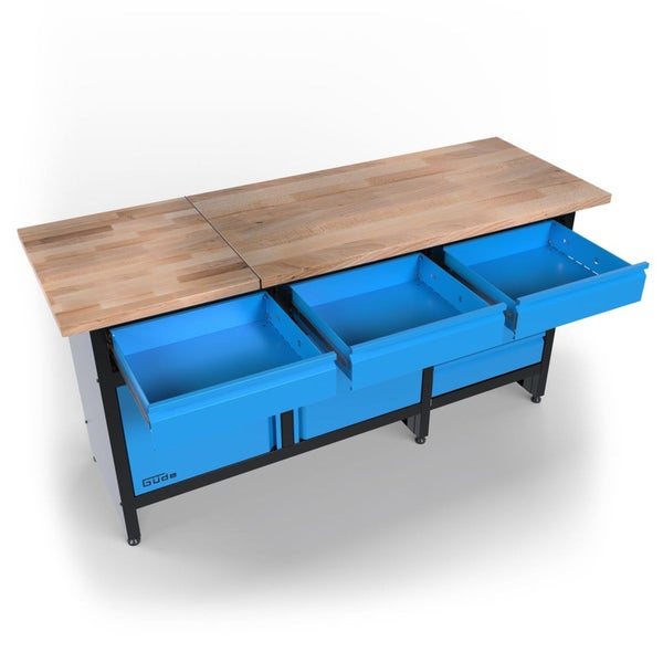 Güde Werkbank mit massiver Holz-Arbeitsplatte und drei ausgezogenen blauen Schubladen auf einem schwarzen Metallgestell.