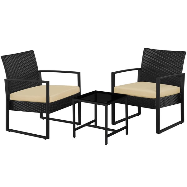 Gartenmöbelset mit zwei Korbsesseln und einem Tisch mit Glasplatte