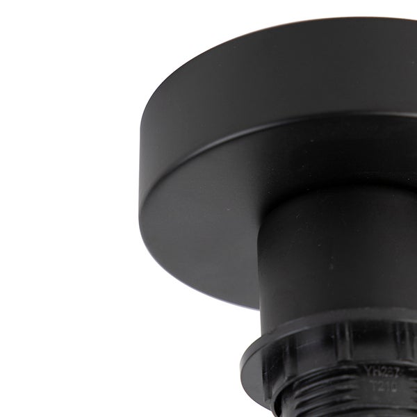 Detailansicht einer mattschwarzen Deckenrosette für Lampen in zylindrischer Form.