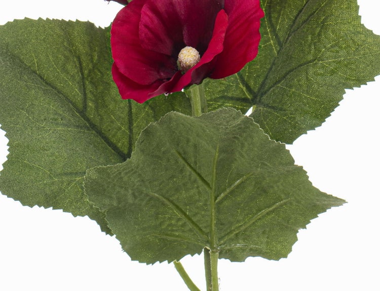 Künstliche Blume mit dunkelroten Blütenblättern und großen grünen Blättern für die Innendekoration.