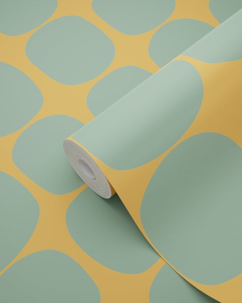 Tapetenrolle mit großen, abgerundeten grünen Formen auf gelbem Hintergrund. Modernes geometrisches Muster.
