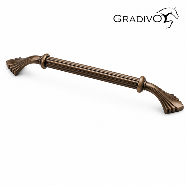 Möbelgriff aus Metall in Bronze antik, geriffelter Bügelgriff mit verzierten Enden. Gradivo Logo.