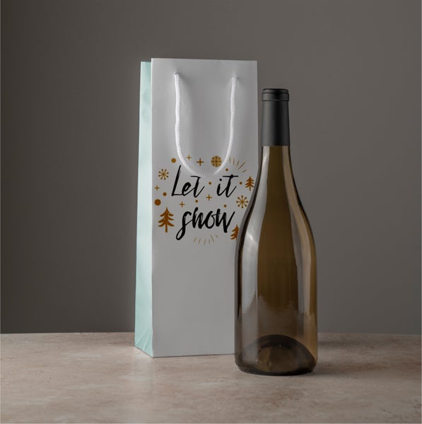 Geschenktüte mit Wintermotiv und Weinflasche