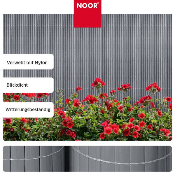 Noor Sichtschutzmatte aus Kunststoff mit Nylonfaden verwebt blickdicht und witterungsbeständig vor roten Blumen