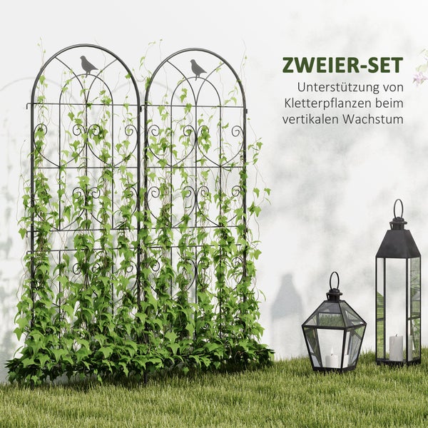Zweier-Set schwarze Rankgitter aus Metall mit Vogel-Ornamenten und dekorativen Schnörkeln, bewachsen mit Kletterpflanzen im Garten.