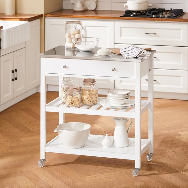 Küchenwagen mit Schublade, Regalen und Rollen in einer hellen Küche.