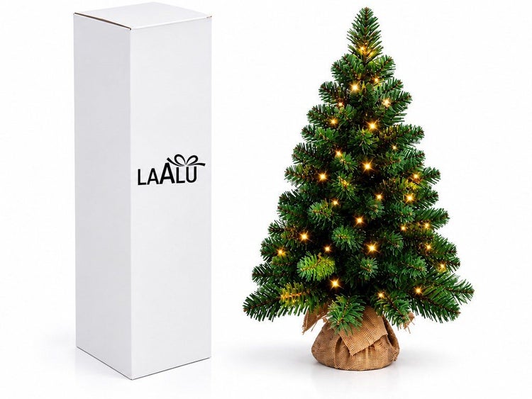Künstlicher Weihnachtsbaum mit LED Beleuchtung im Jutesack neben Laalu Logo Karton