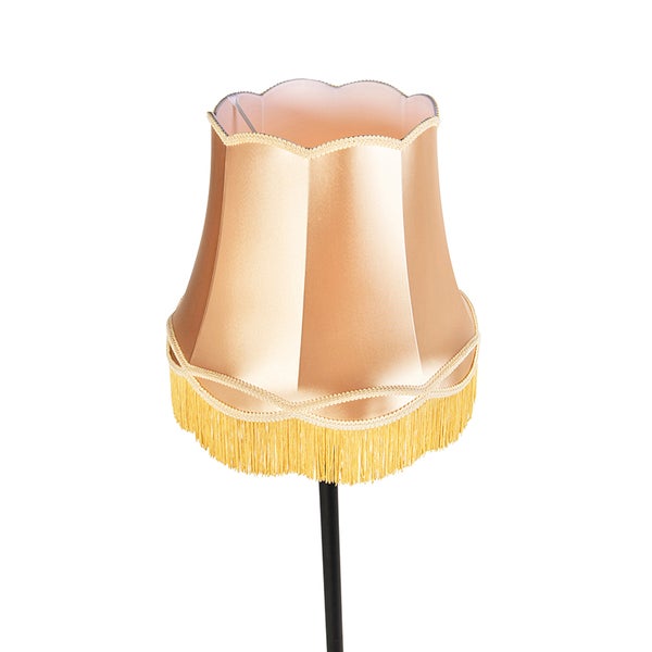 Klassischer goldener Lampenschirm aus Stoff mit gewelltem Rand, dekorativer Borte und Fransen.